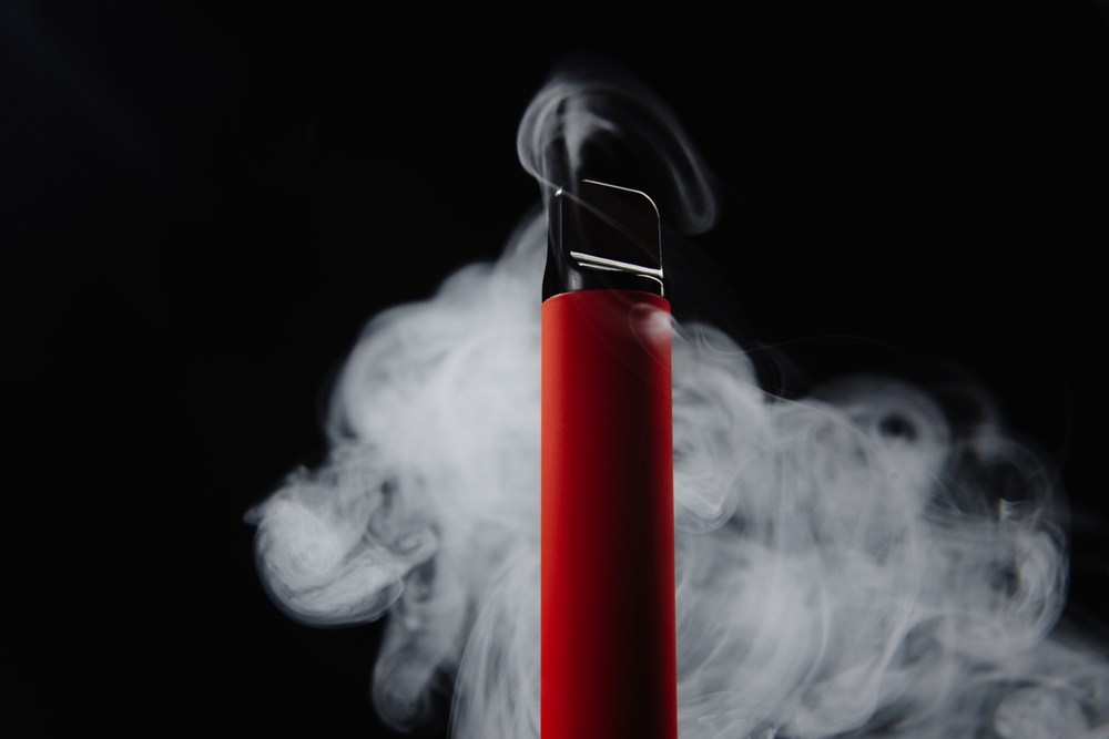 Colorful,disposable,e Cigarette,,on,a,black,background.,the,concept,of